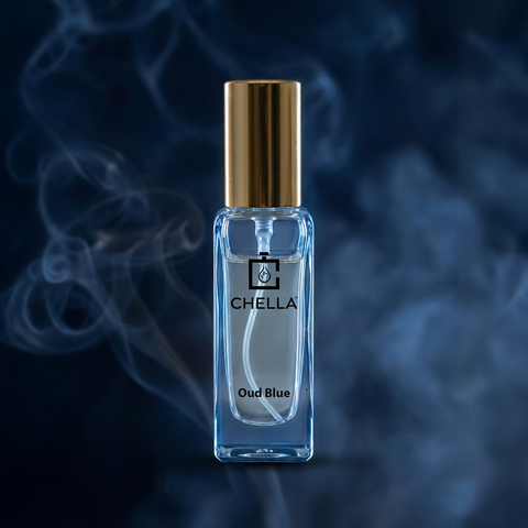 Chella Oud Blue perfume bottle with gold cap on a dark background